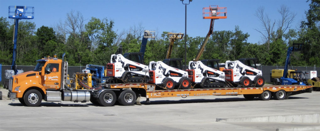 Vandalia Rental semi truck hauling construction equipment