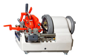 Industrial pipe thread cutting machine isolated on white background. essential plumbing equipment